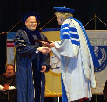 Laumann receiving award