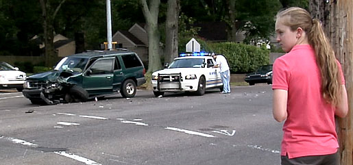 Filmmaker, Mackenzie Leake, at one of the accident scenes she photographed during the year she was making her documentary and conquering her fear of driving.