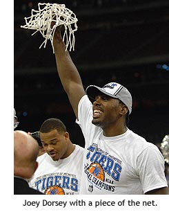 Dorsey holds up a piece of the net.