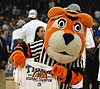 Pouncer holds up a regional championship T-shirt.