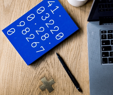desktop with book and pen