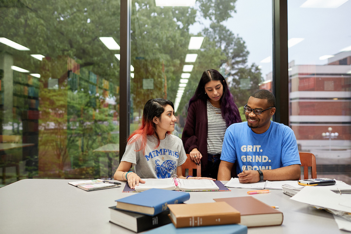 University of Memphis students on campus studying together in the Library