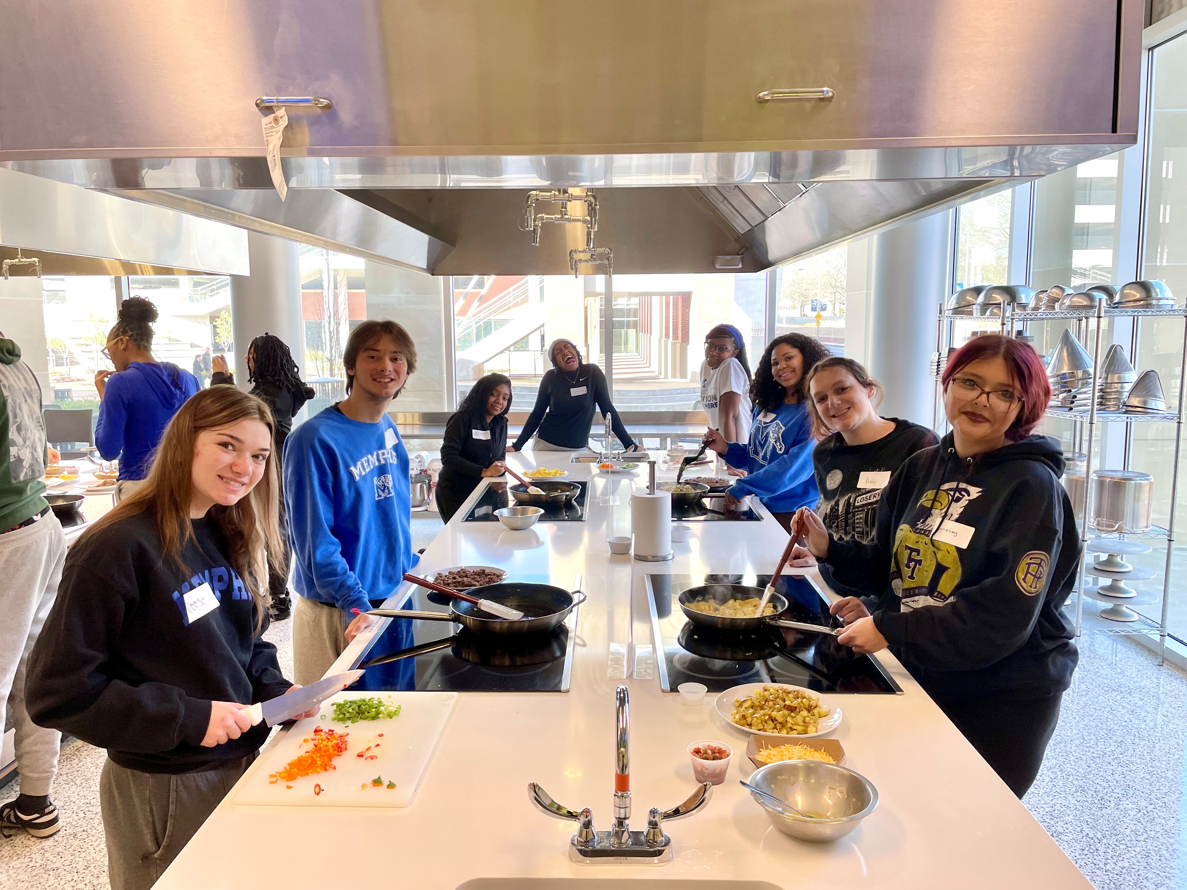 Orientation guide cooking class students cooking