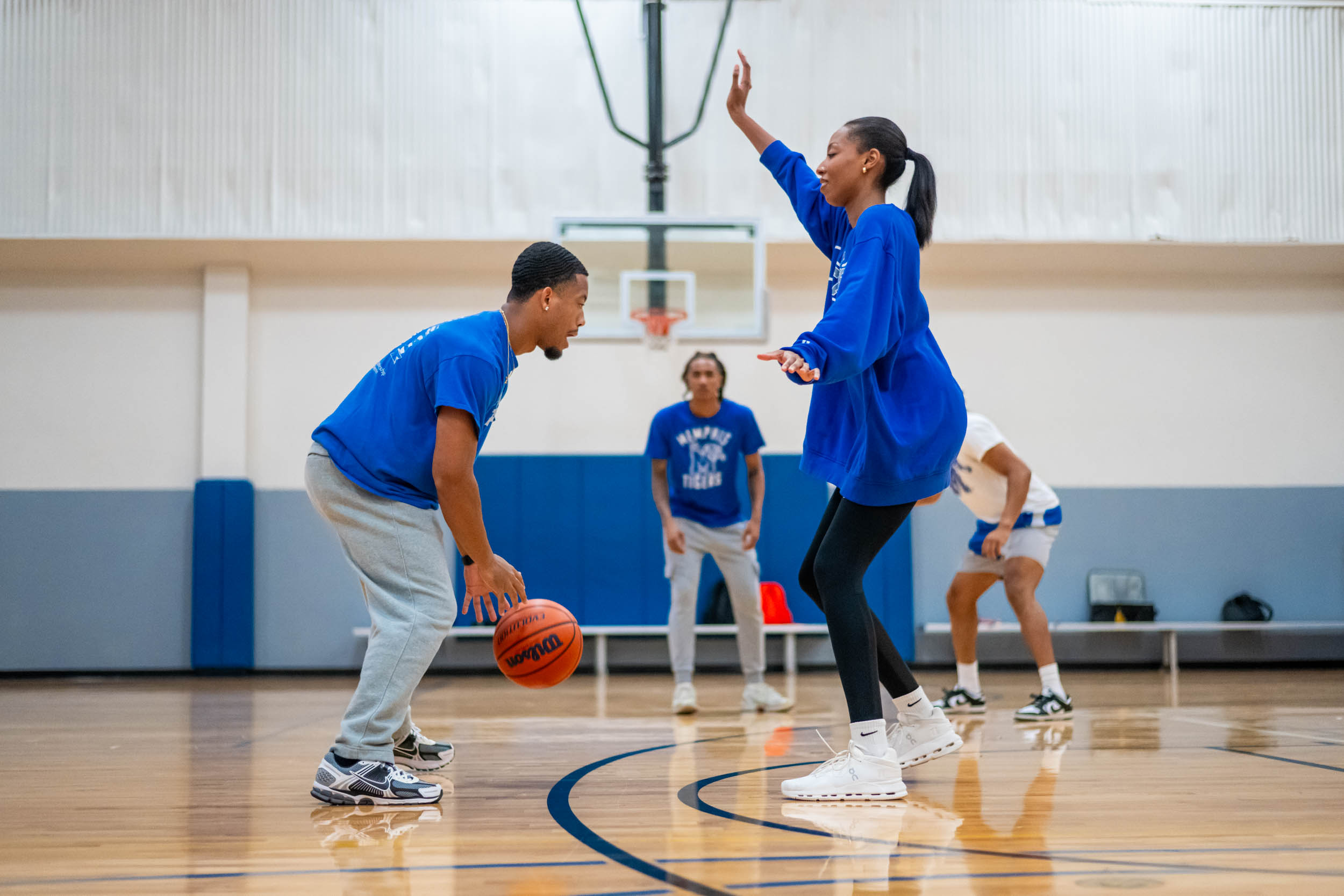 Students playing basketball basketball game