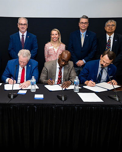 University leaders from the University of Memphis, the University of Arkansas, the University of Mississippi, and the University of Tennessee Health Science Center participate in a joint signing ceremony.