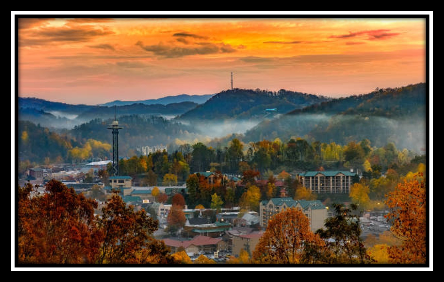 A picture showing Knoxville, Tennessee with the Smoky Mountains behind it.