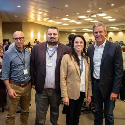 From left, Christopher Ramezanpour, Shawn Brown, Jennifer Mandel with TN Gov. Bill Lee