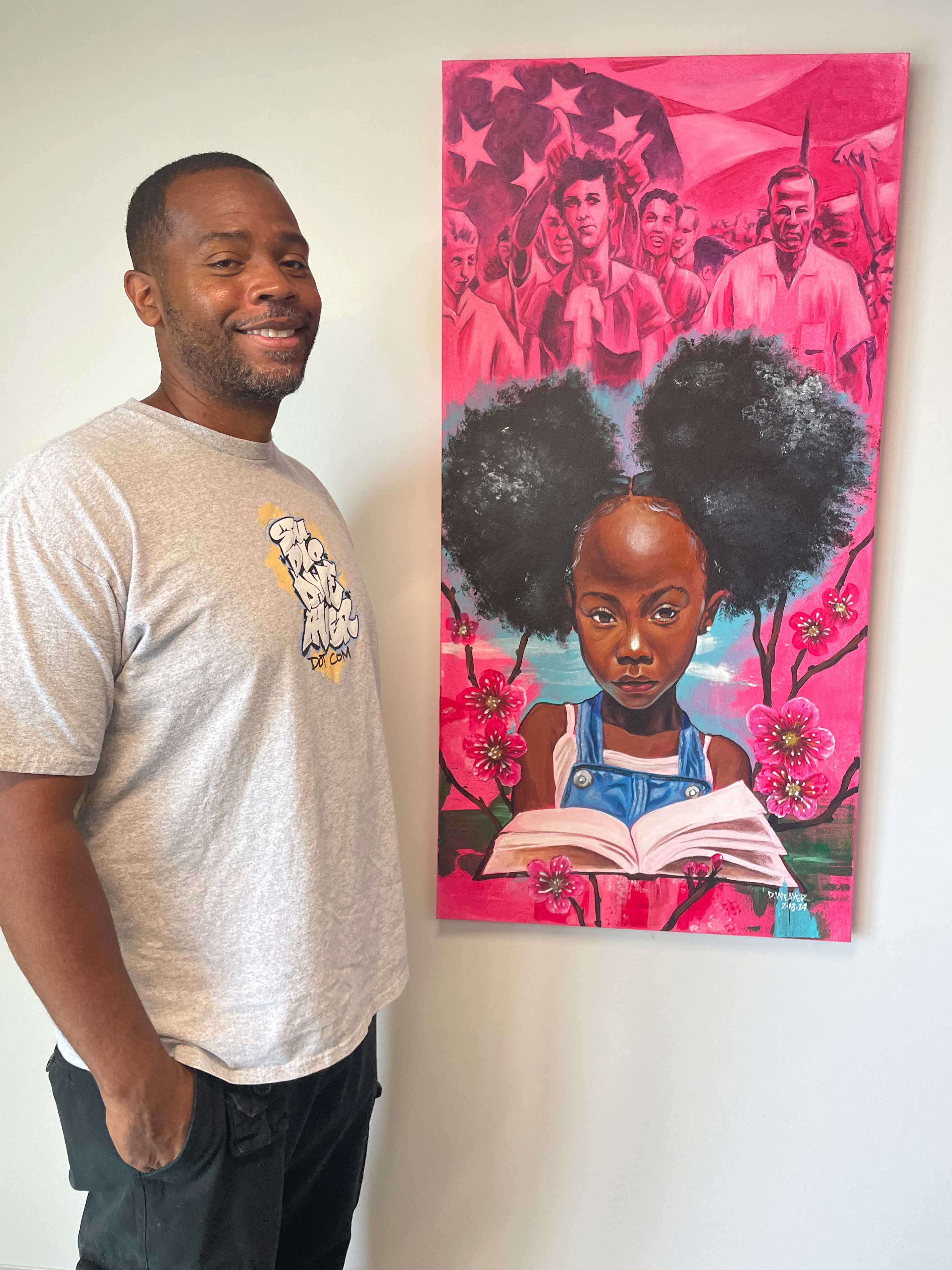 D. Weaver with his art piece "The Story is Not Over"