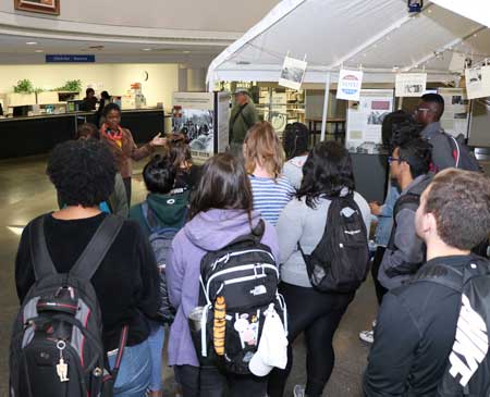 Daphene R. McFerren discusses "Tent City" display with students