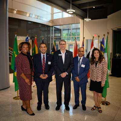 Dean Joshi and UofM Provost pose for a photo with others at UofM SPH Public Health Summit