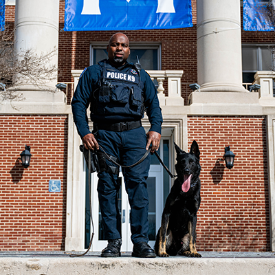 UofM Police Officer James Anderson poses with new new K-9, Pharaoh