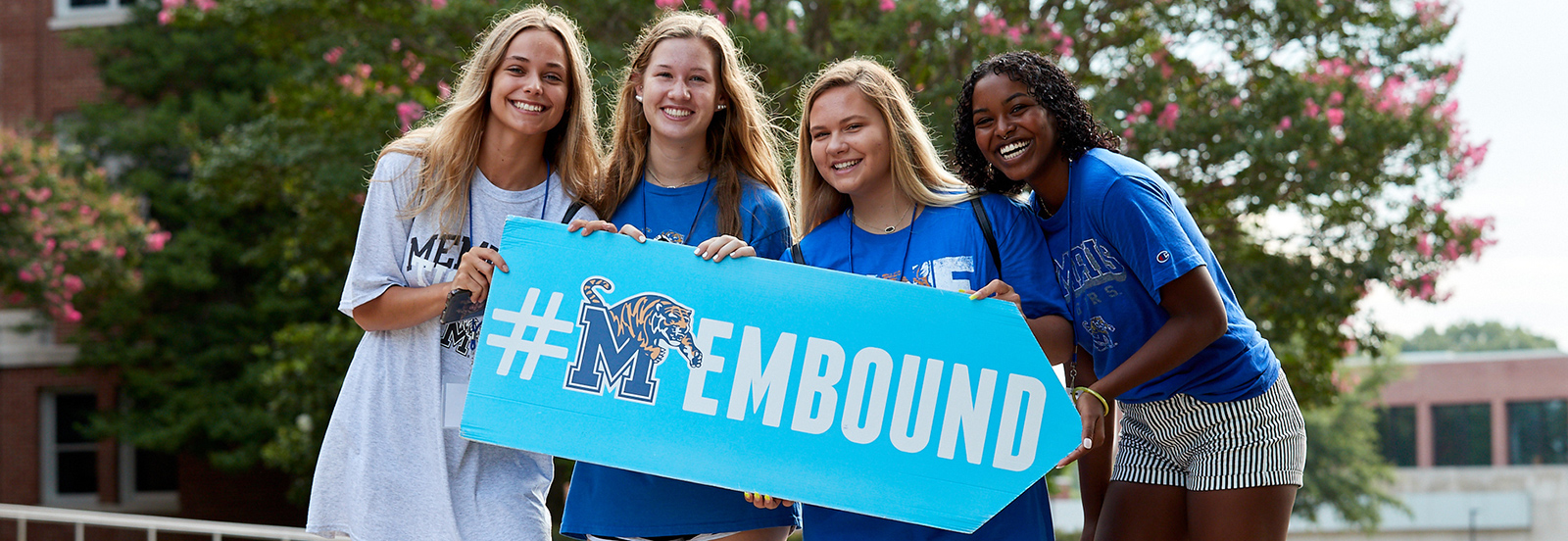 four students with #MEMbound sign