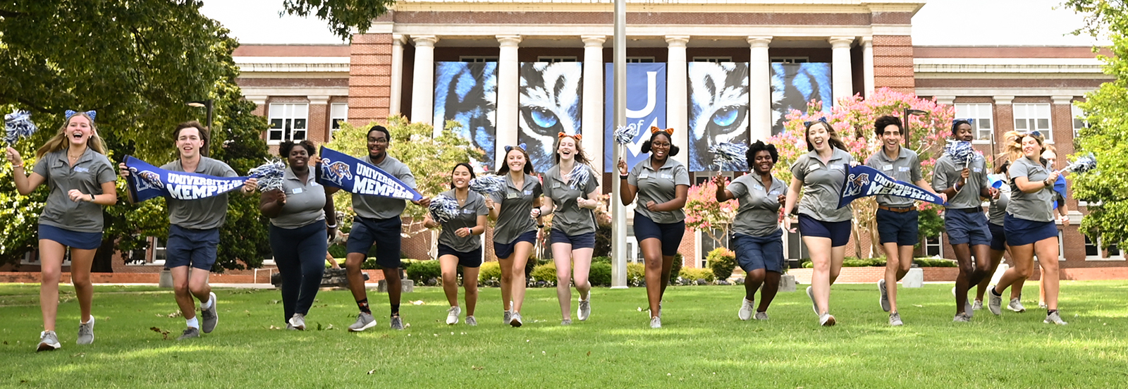orientation guides running towards camera with excitement