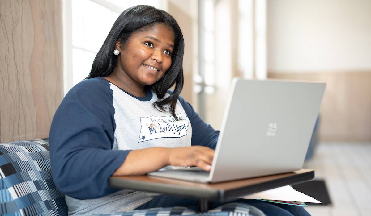 student at laptop