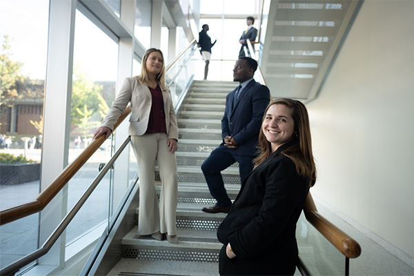 Alumni - People standing in an office building