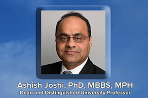 Headshot of Ashish Joshi, Fountain in background