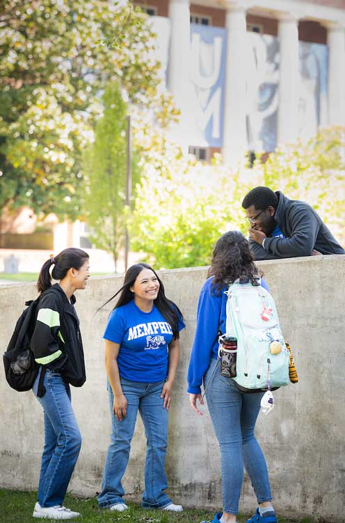 Four students talking on campus