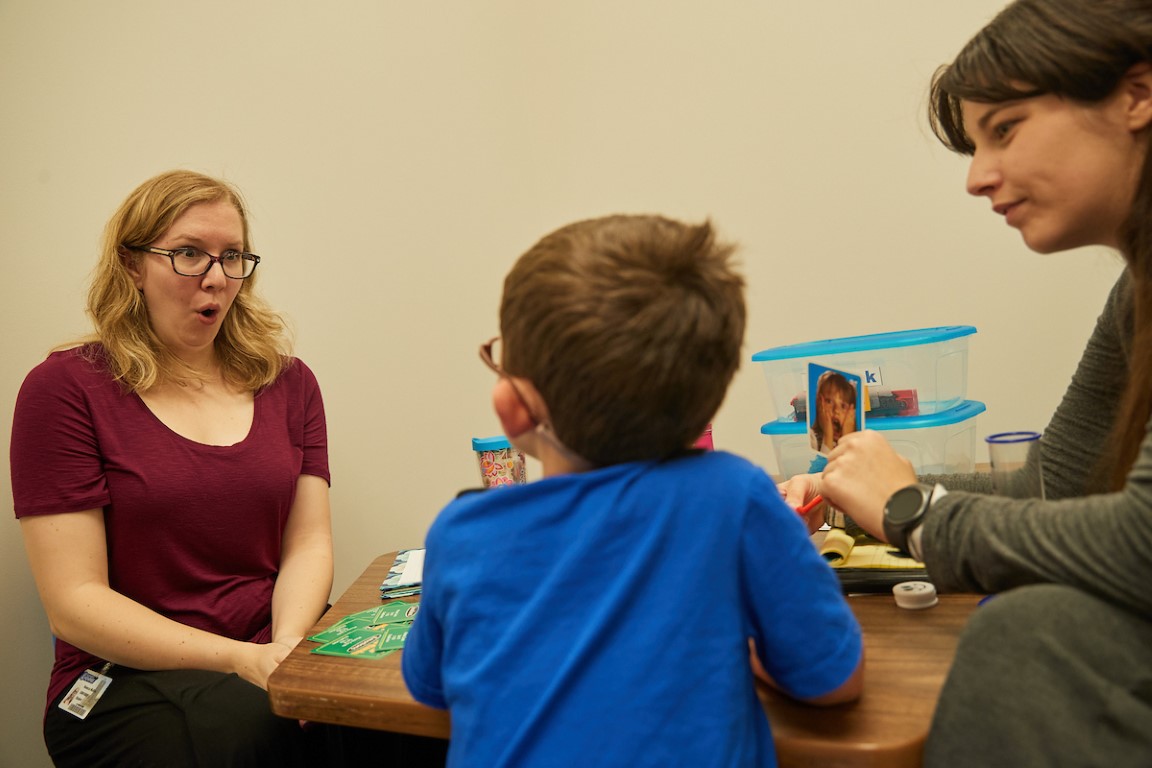 CSD autism studies lab with child