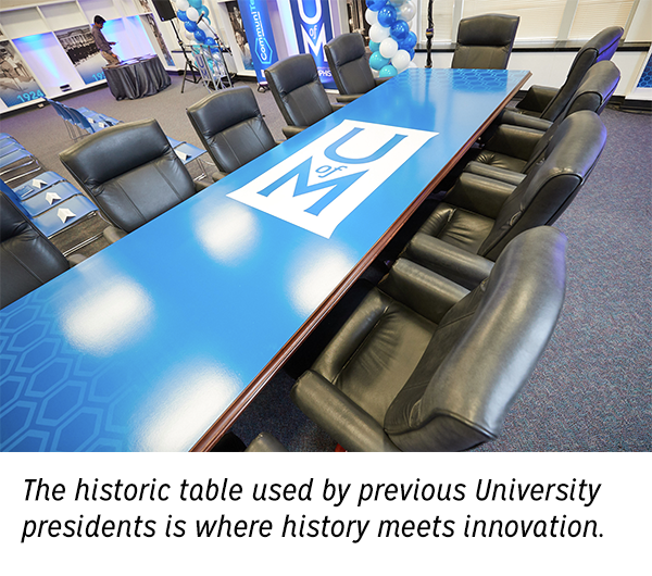 Photo of conference table - "The historic table used by previous University presidents is where history meets innovation.""