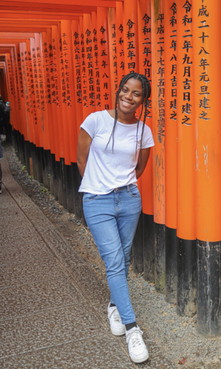 Cierra Dennis, a senior at the University of Memphis majoring in World Languages & Literatures with concentrations in Chinese (Mandarin), Spanish, and French, along with International Business and Asian Studies & International Trade, stands smiling in front of bright red torii gates in Japan. Cierra has a minor in International & Global Studies and is passionate about language learning, having also studied Japanese, Korean, and ASL. Her hobbies include reading, watching movies, and learning new languages, and she dreams of traveling the world.